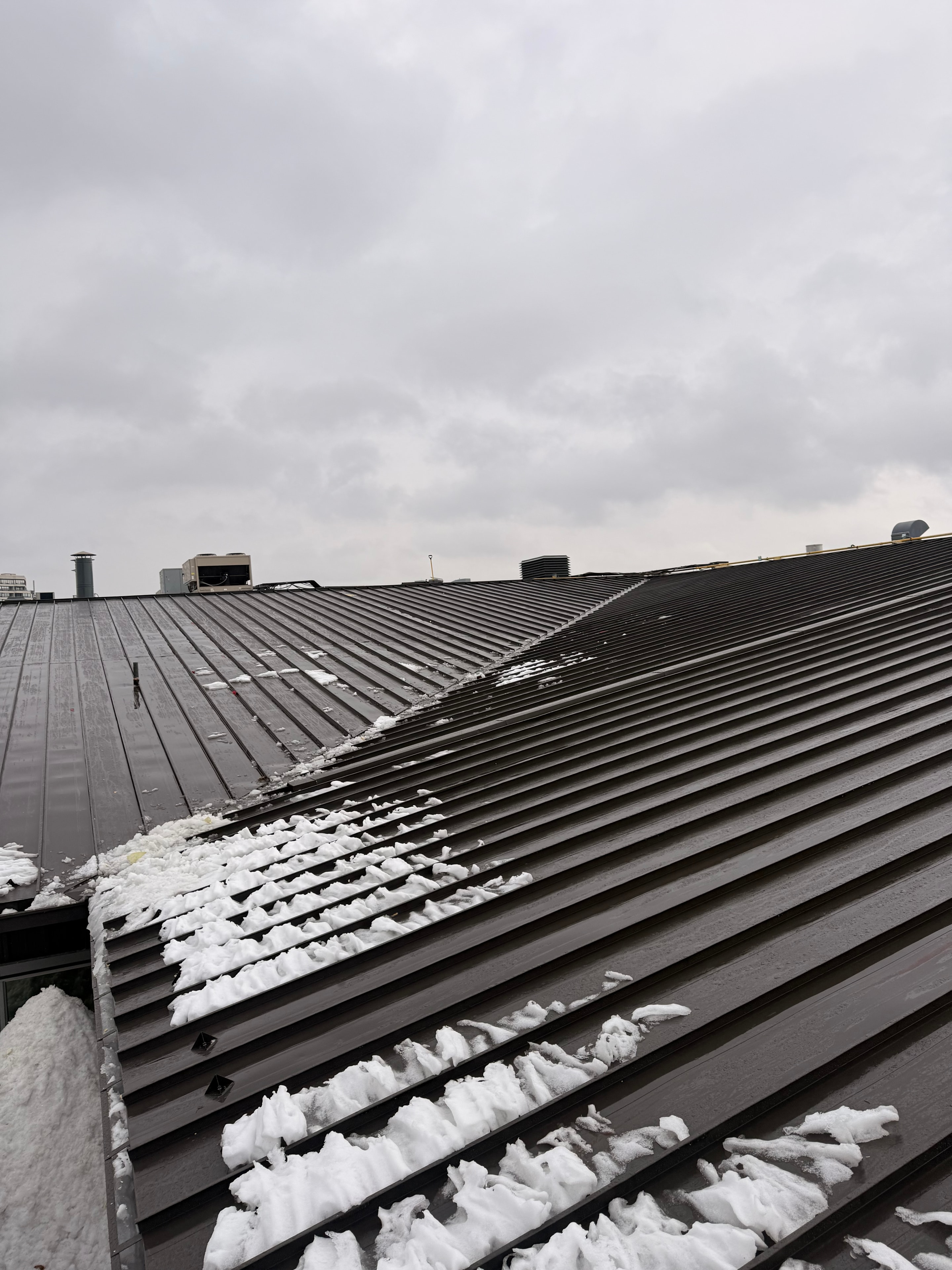 Standing seam metal roofing — ridge and hip detail, GTA