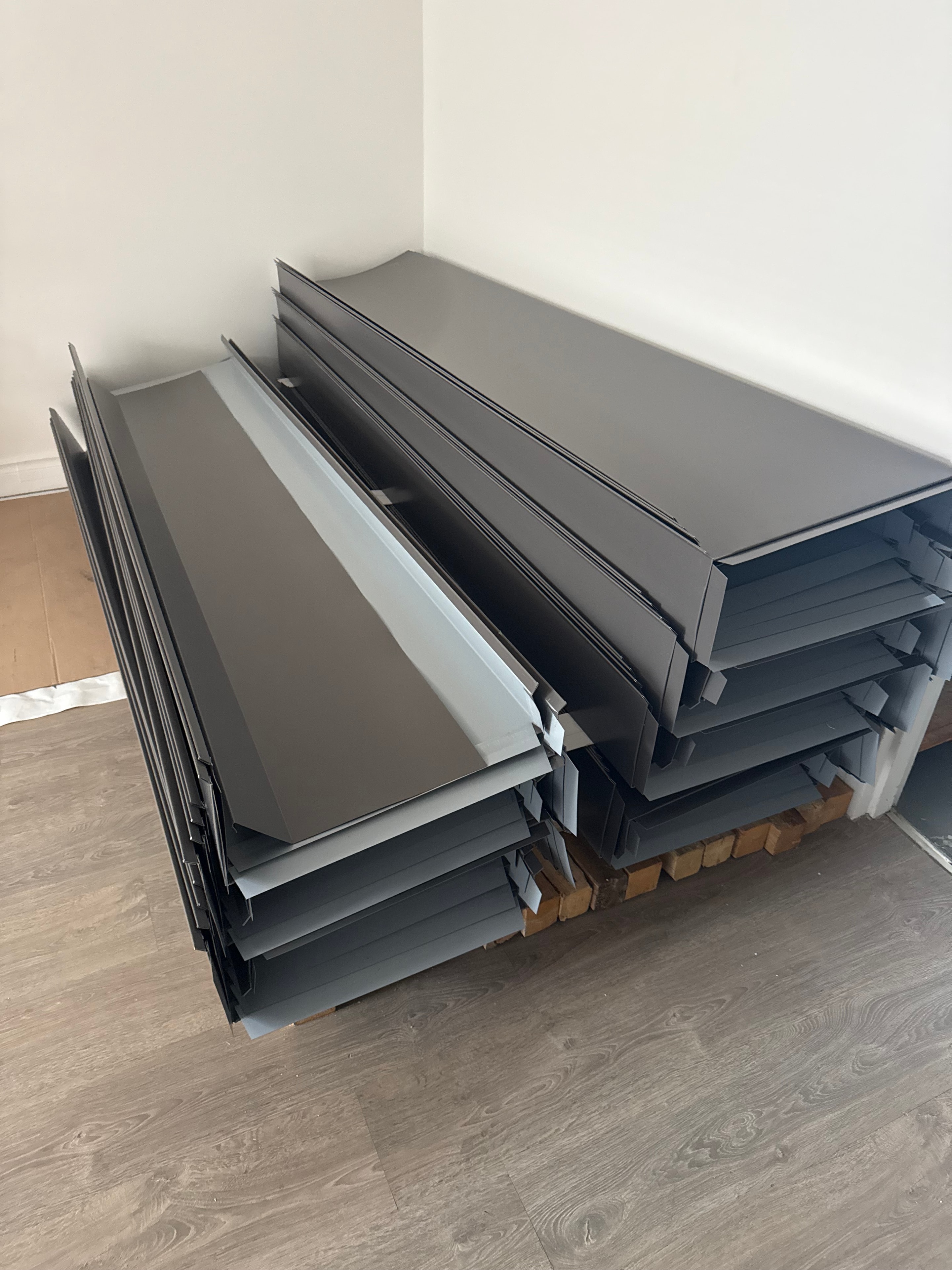 Custom Charcoal Metal Panels — Stacked and Ready for Installation — Primus Sheet Metal Corp. GTA