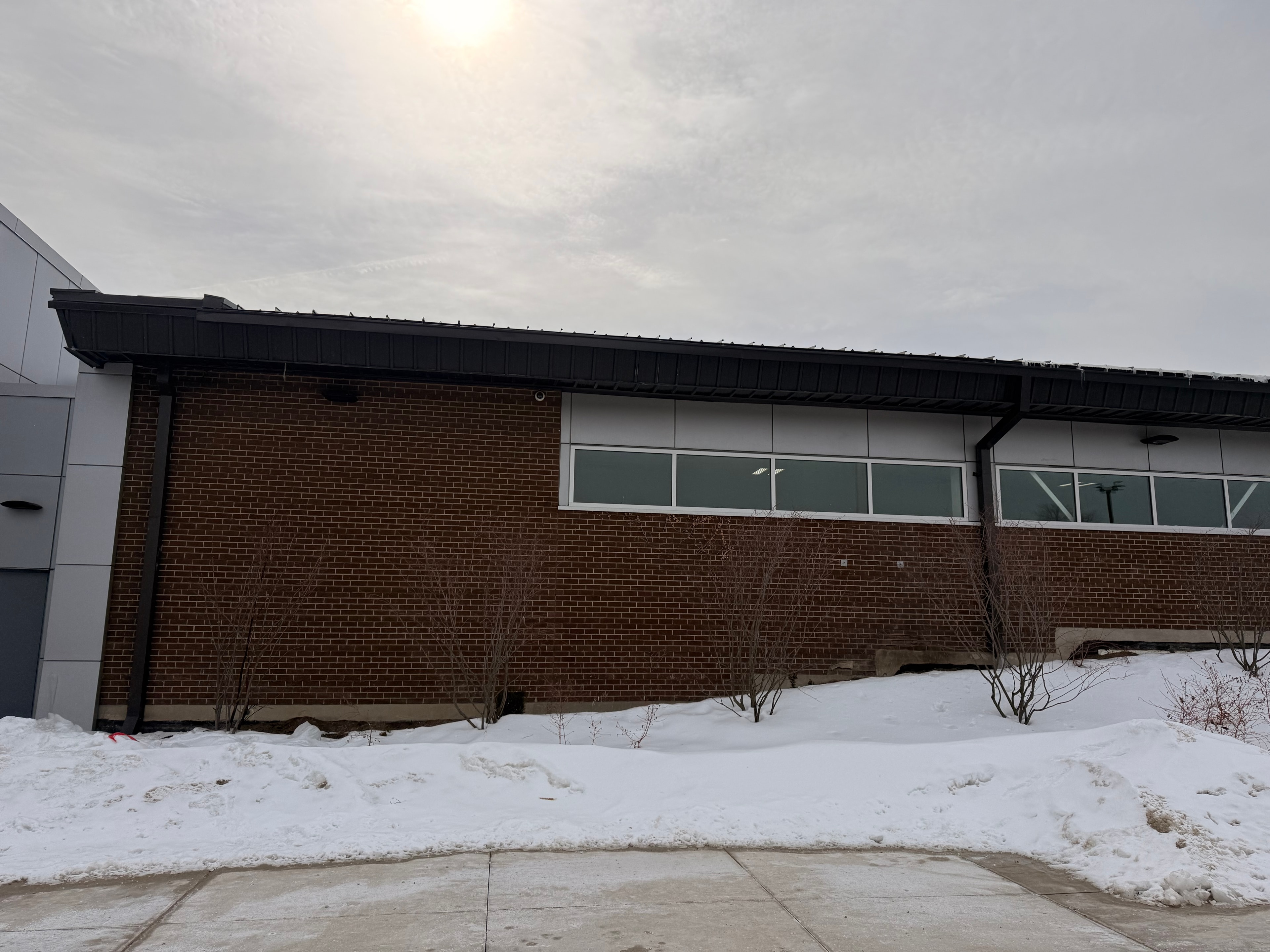 Dark Eavestrough — Commercial Brick Building, Winter — Primus Sheet Metal Corp. GTA