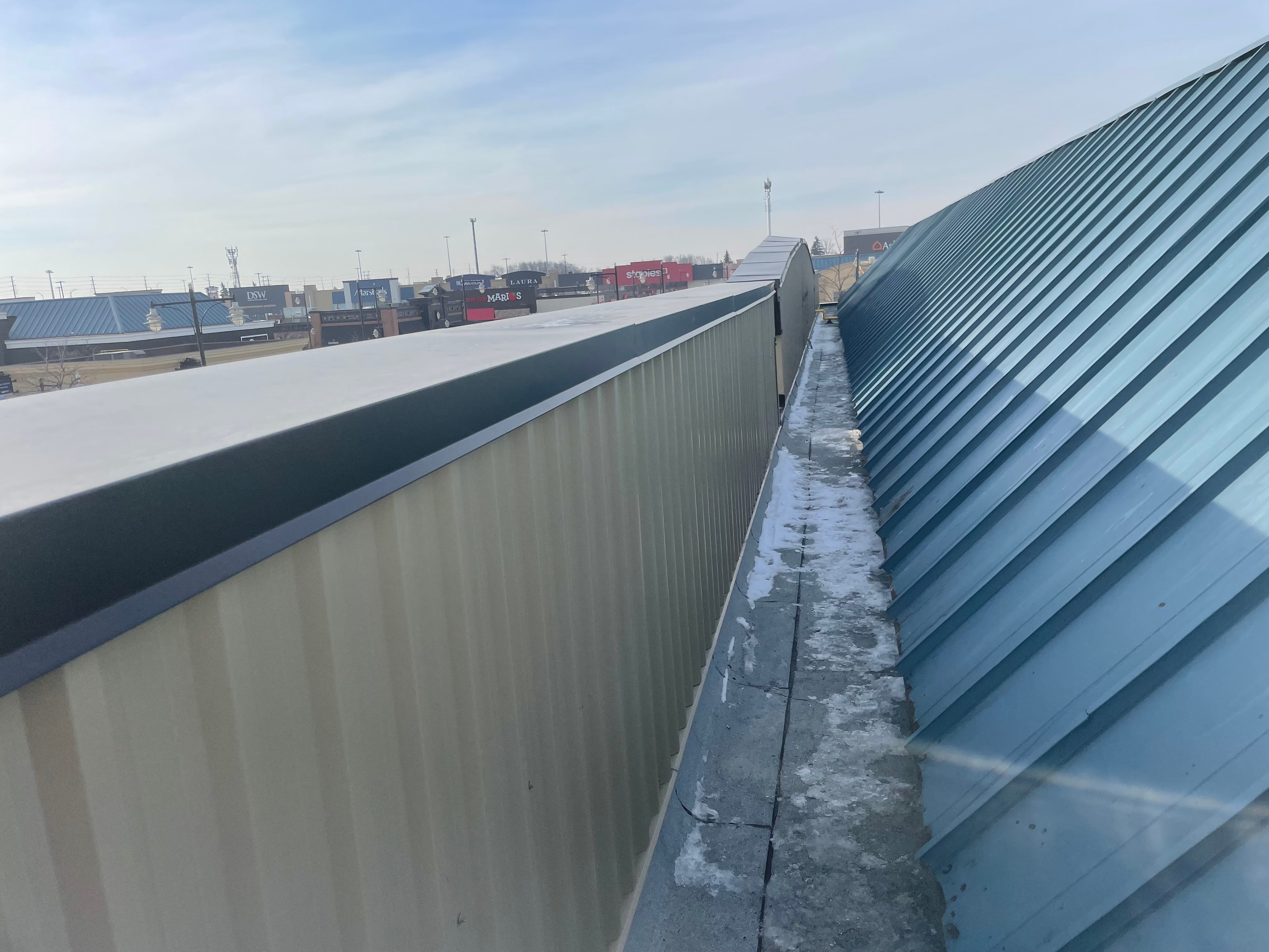 Exposed fastener metal roofing — commercial building, GTA