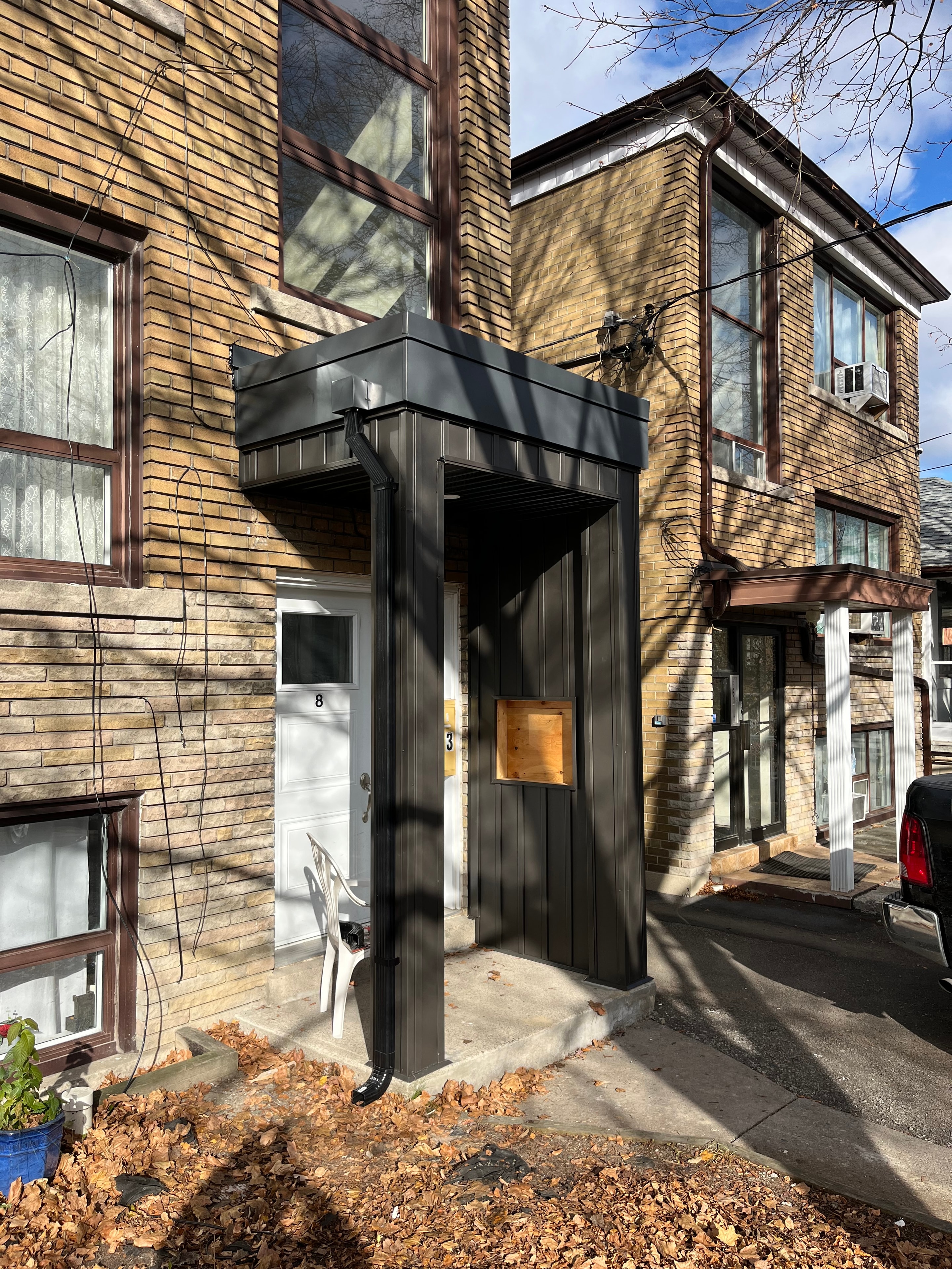 Residential Metal Cladding — Dark Panels, Brick Facade — Primus Sheet Metal Corp. GTA