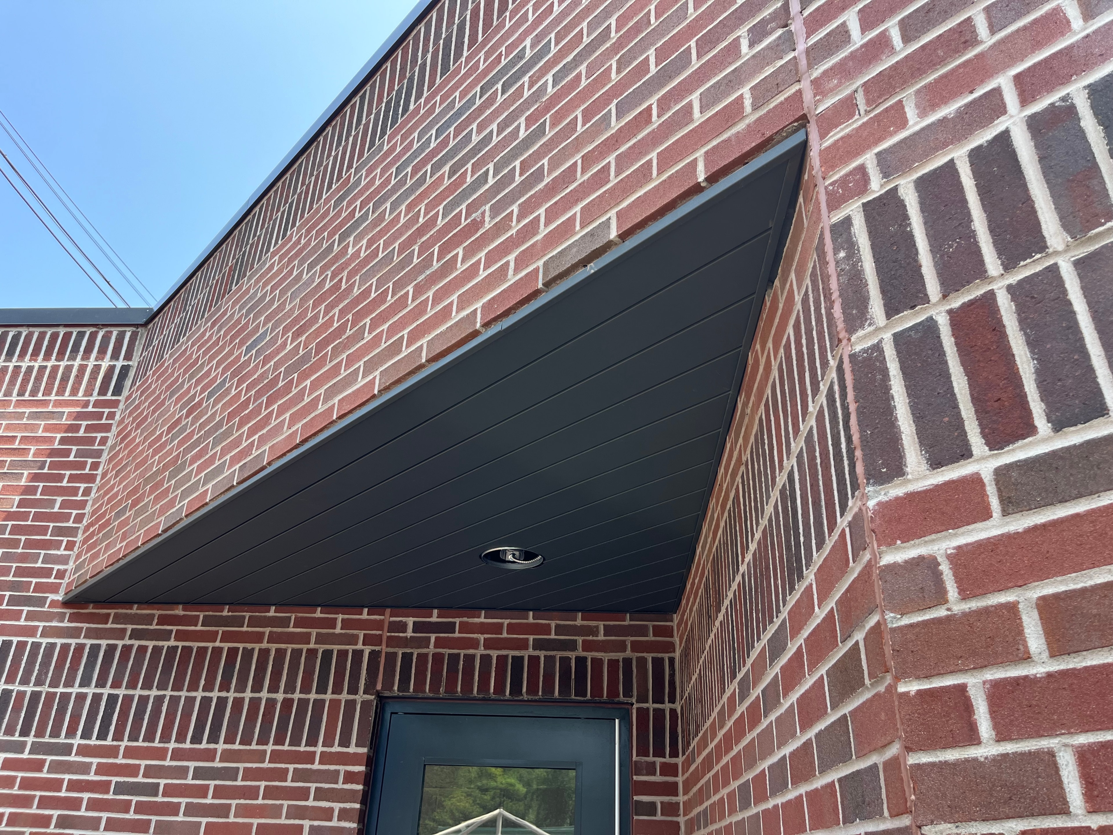 Metal Soffit — Angled Entry Canopy, Brick Facade — Primus Sheet Metal Corp. GTA