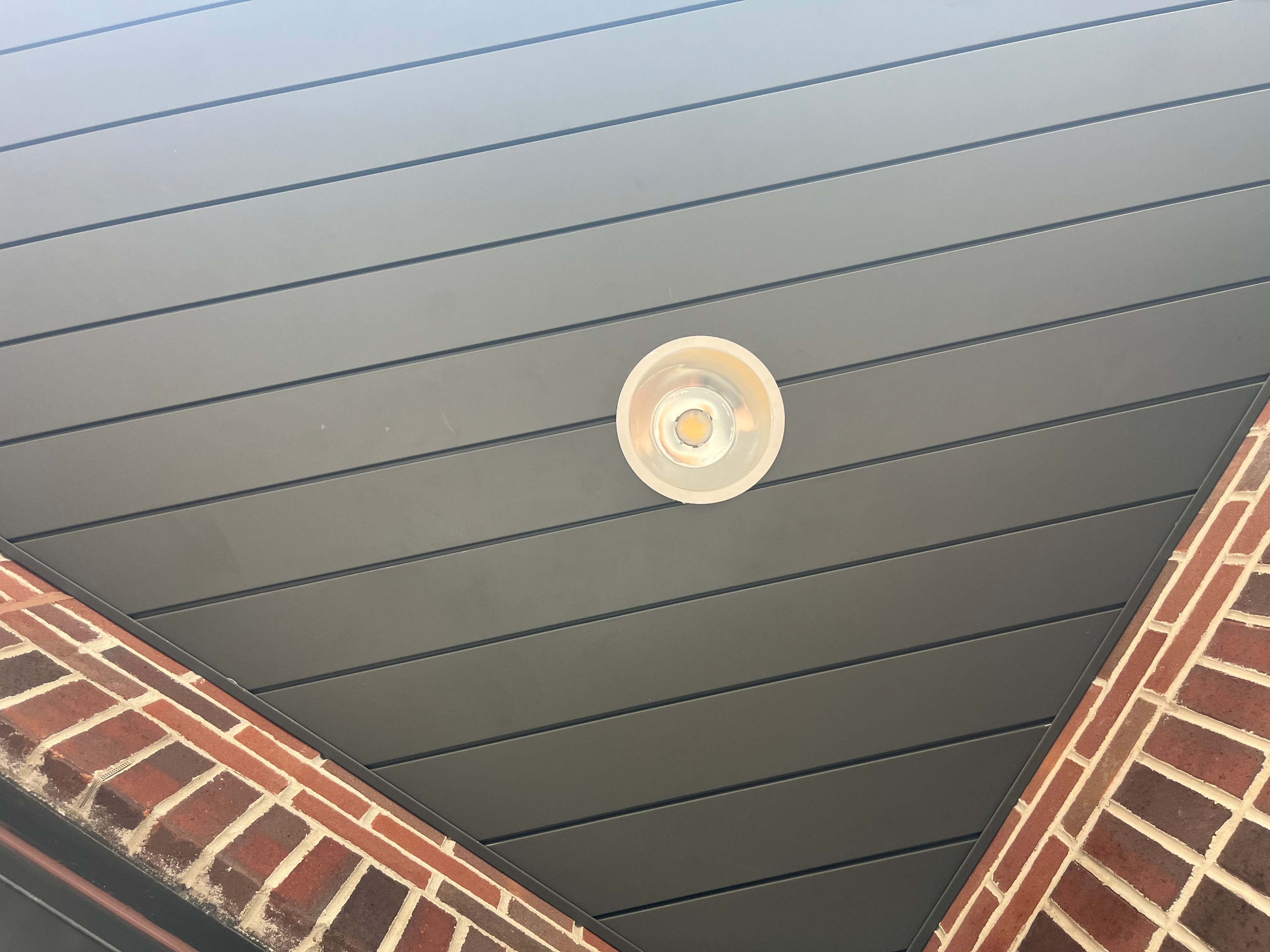 Dark Metal Soffit — Recessed Pot Light, Brick Detail — Primus Sheet Metal Corp. GTA