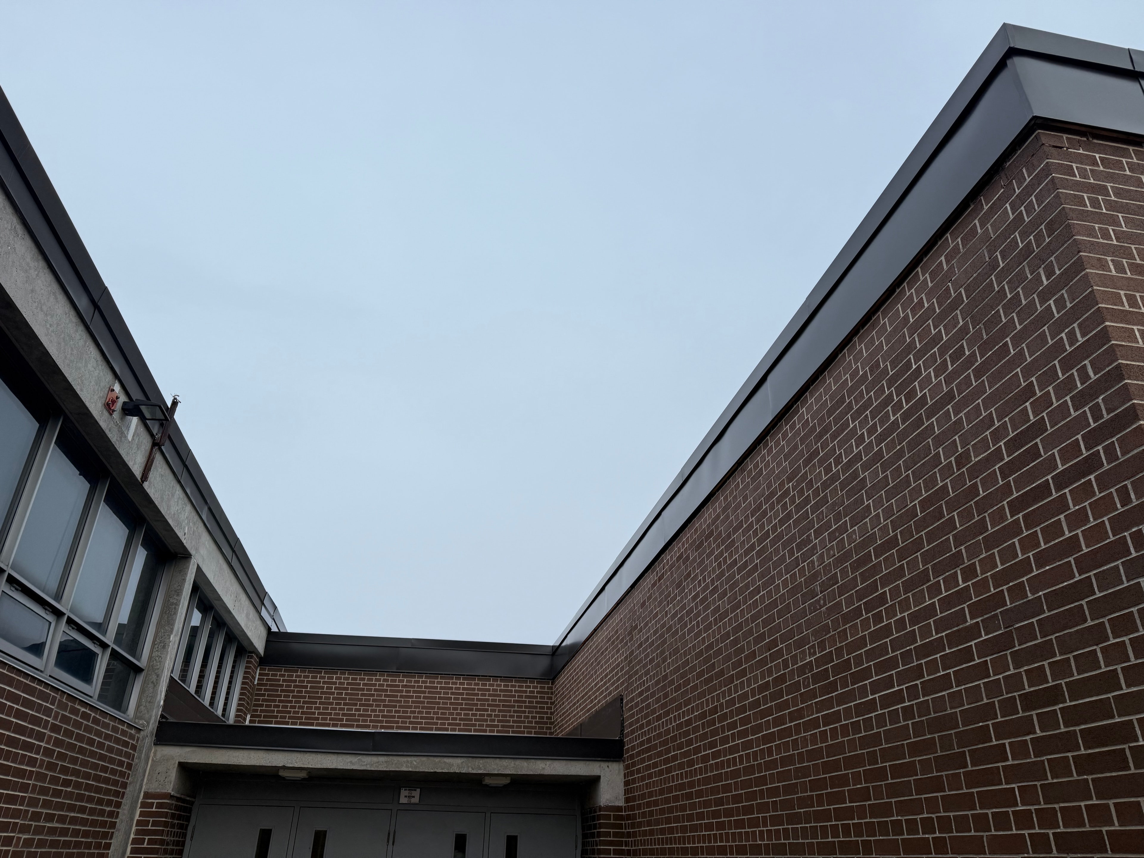 Dark Metal Fascia — School Building Courtyard — Primus Sheet Metal Corp. GTA