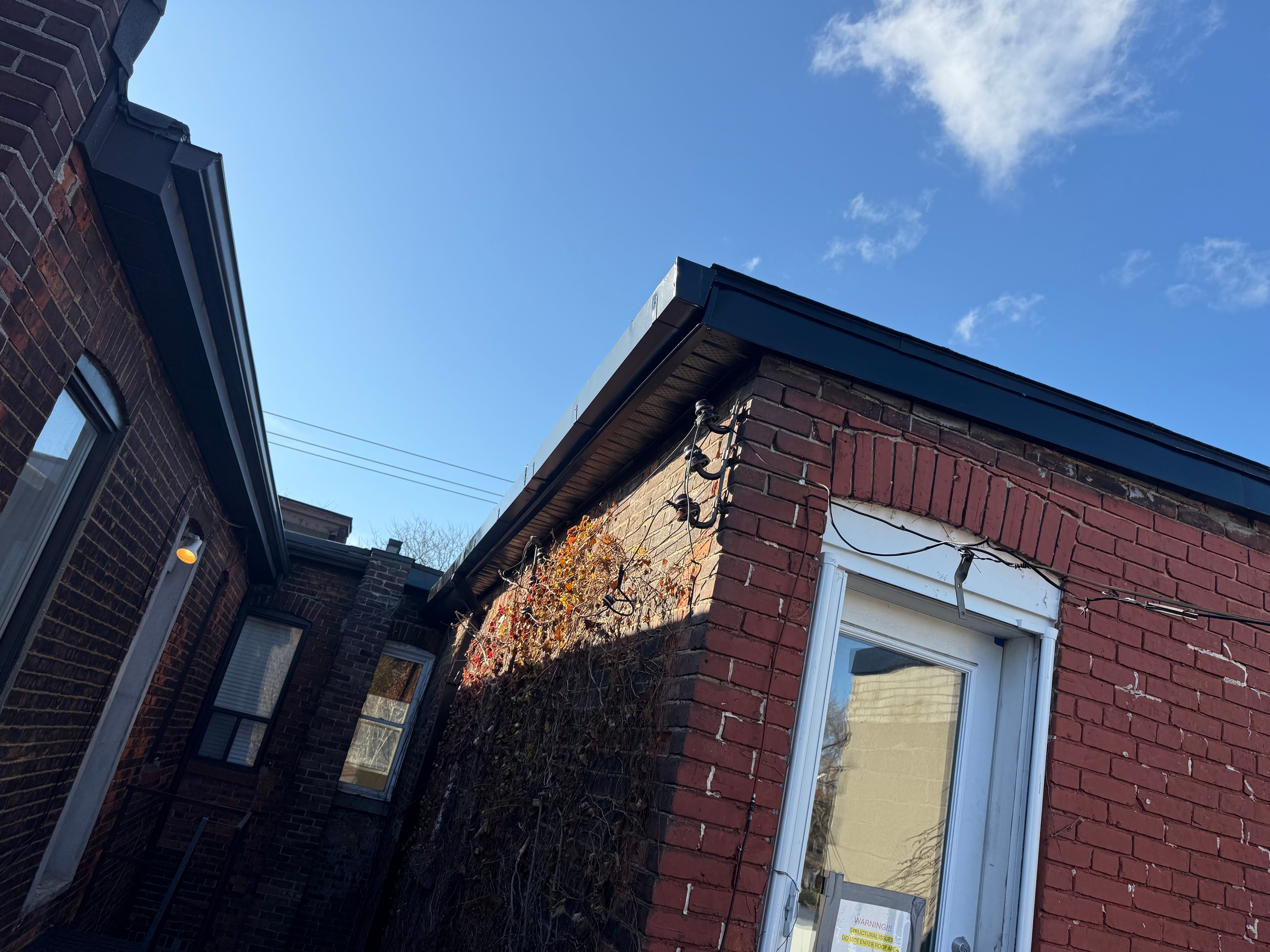 Dark Metal Fascia — Residential Roofline, Brick — Primus Sheet Metal Corp. GTA