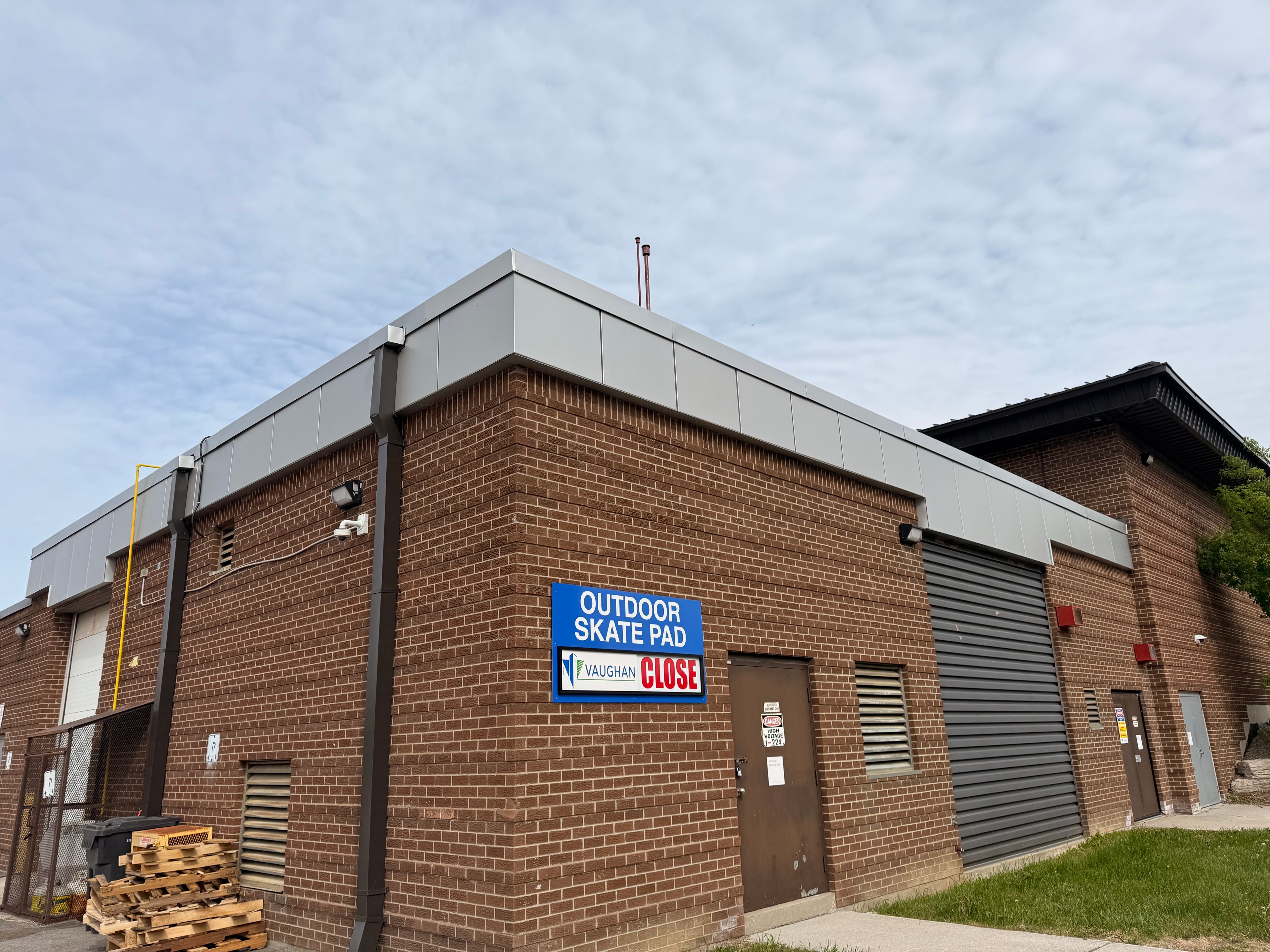 Eavestrough and downpipe — residential bungalow, rear view, GTA